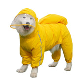 Pet Clothing Hoodie Raincoat on a happy dog wearing a bright yellow waterproof outfit with a hood for protection against rain.